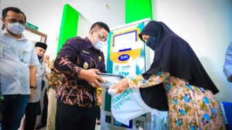 Alhamdulillah! Di Banda Aceh Ada ATM Beras Untuk Warga Kurang Mampu