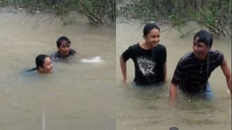 Bikin Publik Iri, Ayah dan Anak Hujan-hujanan Pamer Aksi Salto saat Banjir