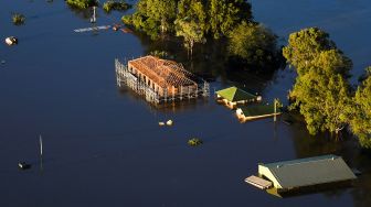 Suasana banjir di daerah Windsor, Sydney, Australia, Rabu (24/3).  LUKAS COCH / POOL / AFP
