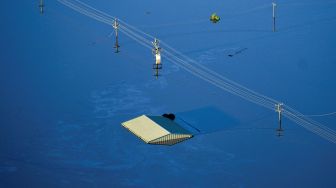 Suasana banjir di daerah Windsor, Sydney, Australia, Rabu (24/3).  LUKAS COCH / POOL / AFP
