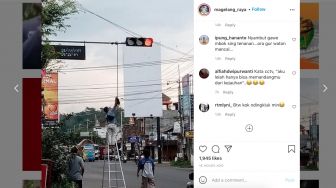 Pakai Sapu, Petugas Ini Betulkan Posisi CCTV di Traffic light, Warganet: Kata CCTV, Aku Lelah