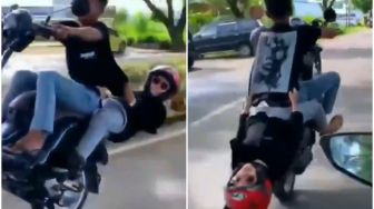 Ngeri! Viral Video Dua Sejoli Atraksi Motor, Kepala Hampir Sentuh Aspal