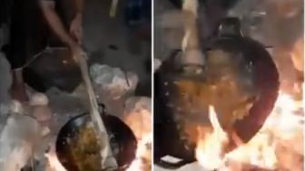 Aksi Kocak Pria Masak Pakai Cangkul, Cara Ngaduknya bak Kuli Bangunan