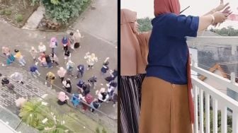 Heboh! Aksi Wanita Sebar Uang Rp 100 Juta dari Balkon Bikin Warga Histeris