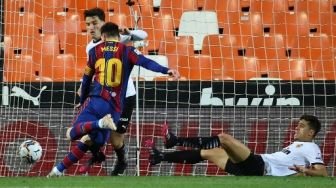 Cetak Gol Indah ke Gawang Valencia, Messi Tambah Rekor di Barcelona