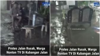 Viral Aksi Protes Jalanan Rusak, Warga Nekat Nonton TV di Kubangan Air