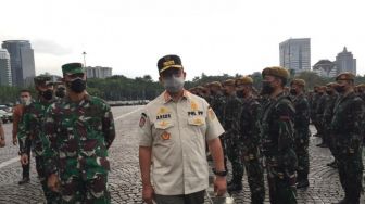 Anies Pimpin Apel Pasukan di Monas: Pandemi di Jakarta Makin Hari Kian Mengkhawatirkan