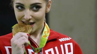 Kebiasaan Gigit Medali Tak Bisa Dilakukan Atlet di Olimpiade Tokyo 2020, Ini Alasannya