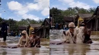 Viral Pengantin Lakukan Pemotretan di Tengah Banjir, Warganet Soroti Ini