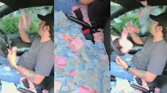 Viral Pria Hamburkan Uang Sambil Nyetir Mobil, Auto Diserbu Netizen