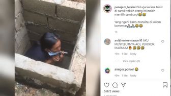 Viral Takut Divaksin, Ibu Ini Sembunyi Sembari Merokok di Dalam Selokan