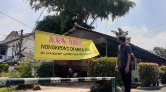 Balai RW di Pamulang Tangsel Dipasangi Spanduk Peringatan Kesurupan, Ini Penyebabnya