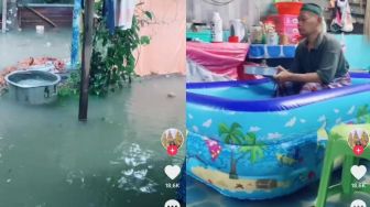 Padahal Kebanjiran, Abah Ini Tetap Santai Makan Kerupuk dalam Kolam Balon