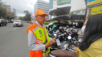 Dishub Medan Ingatkan Jukir E-Parking Tak Terima Retribusi Parkir Tunai, Jika Dilanggar Ini Sanksinya