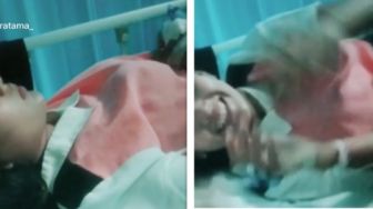 Viral Suami Bangunkan Istri yang Sedang Diinfus, Warganet Ngeri: Bercandanya Keterlaluan
