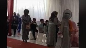 Viral Ibu Ke Kondangan Pakai Helm Jadi Pusat Perhatian Tamu