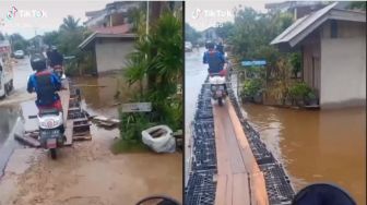Jalan Banjir, Pemotor Pakai Jembatan Darurat, Warganet: Senggol Dikit Berakhir