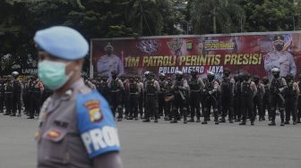 Anggota polisi mengikuti upacara peresmian tim Perintis Presisi Polda Metro Jaya di Lapangan Presisi Polda Metro Jaya, Jakarta, Kamis (13/1/2022). [Suara.com/Angga Budhiyanto]
