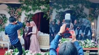 Viral Penampakan Panggung Pernikahan &#039;Agak Lain&#039;, Warganet Ikut Cemas dengan Keselamatan Fotografernya