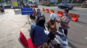 Inovatif! Operasi Keselamatan Candi 2022 Polresta Banyumas, Sediakan Vaksinasi Drive Thru di Alun-alun Purwokerto