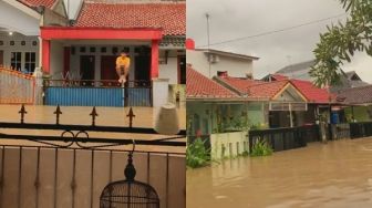 Banjir Bandang Melanda Rumah, Cowok Ini Terekam Lagi Santai Nangkring di Atas Pagar