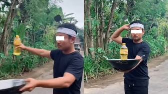 Sindir Pemerintah? Seorang Pria Beraksi Bak Pawang Hujan, Bawa Wajan dan Minyak Goreng: Ritual Turunkan Harga Minyak