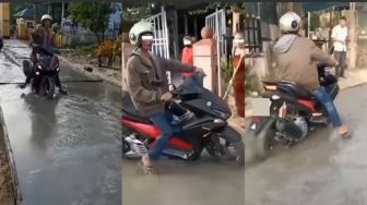 Cor-coran Jalan Masih Basah, Bapak Ini Nekat Terabas Naik Motor bak Tak Ada Dosa, Warga sampai Speechless