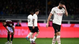 Pemain depan AC Milan Olivier Giroud bereaksi selama pertandingan sepak bola Serie A Italia antara Torino melawan AC Milan di Stadion Olimpiade di Turin, Senin (11/4) dini hari WIB.  MARCO BERTORELLO / AFP