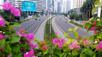 Suasana di Jalan Sudirman, Jakarta, Sabtu (30/4). [Suara.com/Oke Atmaja]

