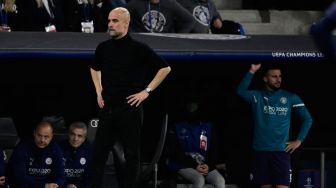 PeReaksi pelatih Manchester City Josep Guardiola saat pertandingan sepak bola leg kedua semifinal UEFA Liga Champions antara Real Madrid dan Manchester City di stadion Santiago Bernabeu, Madrid, Spanyol, Rabu (4/5/2022). [JAVIER SORIANO / AFP]
