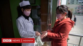 Kim Jong-un Kenakan Masker untuk Pertamakali dan Berlakukan Karantina