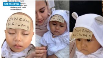 Takut Anaknya Dicium Banyak Orang saat Pesta, Ibu Ini Tempelkan Tulisan 'Jangan Dicium' di Jidat Bayinya