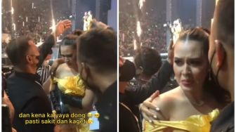 Raisa Terkena Kembang Api Saat Akan Manggung, Warganet Malah Gagal Fokus dengan Sosok Berbaju Hitam