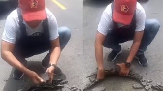 Viral Video Pria Bongkar Aspal Bak Gulung Karpet, Nitizen: Aspal Apa Karpet Talang