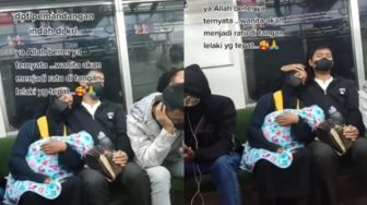 Pria Ini Jaga Si Istri saat Tertidur Gendong Bayi di KRL, Videonya Bikin Para Jomblo Baper