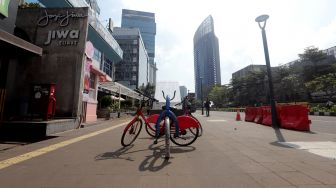 Suasana di Kawasan Sudirman, Dukuh Atas, Jakarta, Jumat (29/7).  [Suara.com/Oke Atmaja]