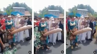 Viral Arak-arakan Manten Bawa Properti Mirip Alat Kelamin Pria, Iringan Sholawat Bikin Publik Naik Darah