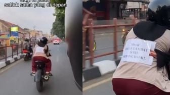 Salut! Tulisan di Punggung Istri Pengendara Motor Ini Bikin Terharu