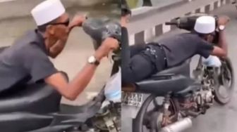 Aksi Pria Tengkurap Naik Sepeda Motor, Dihujat Netizen