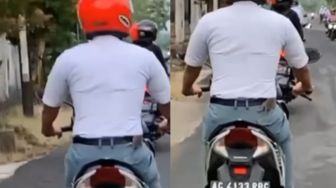Lagi Naik Sepeda Motor di Jalan, Pria Ini Tak Sadar Badannya Digerayangi Tikus