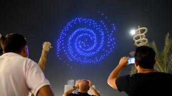 Cara Warga Qatar Nikmati Piala Dunia: Mengelilingi Api Unggun dan Ditemani Shisha