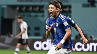 Gelandang Jepang Ritsu Doan selebrasi usai mencetak gol pertandingan sepak bola Grup E Piala Dunia 2022 antara Jerman dan Jepang di Stadion Internasional Khalifa di Doha, Qatar, Rabu (23/11/2022). [INA FASSBENDER / AFP]

