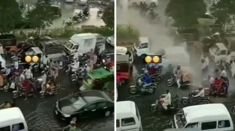 Byur! Momen Pengendara Basah-basahan Diguyur Cipratan Air dari Atas Flyover