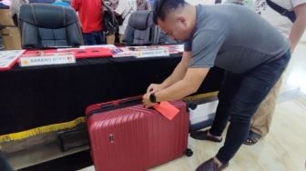 Setengah Badan Tanpa Kepala Terbungkus Koper Merah, Sempat Dianggap Binatang