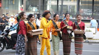 PT Air Mancur Bagikan Gratis Ribuan Gelas Jamu di Acara Car Free Day