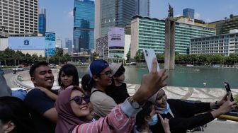 Menikmati Libur Idul Adha dengan Bus Wisata Transjakarta