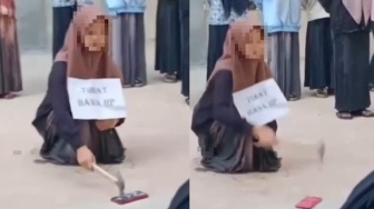 Terciduk Bawa HP ke Pondok Pesantren, Ini Momen Santriwati Hancurkan HP Pakai Palu