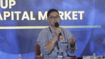 Capital Market Analyst Reza Priyambada saat menjadi narsum Local Media Summit 2023 di Hotel Aryaduta, Menteng, Jakarta Pusat, Rabu (11/10/2023). [Suara.com//Alfian Winanto]