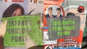 Salut! Aksi Kelompok Masyarakat Ini Tandai Poster Kampanye Caleg yang Terpasang di Pohon, Nonton Videonya!