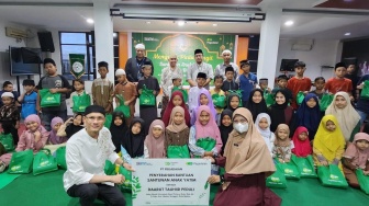 Pegadaian Medan Merangkul Anak Yatim Mengetuk Pintu Langit